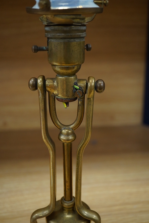 A pair of brass Pullman lamps with gimbal stems and Vaseline glass shades, modelled for wall mounting or freestanding, height to top of shade 40cm. Condition - good